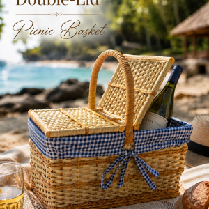 Double-lid wicker picnic basket with blue gingham lining, handcrafted woven picnic hamper for beach picnics, outdoor dining, and luxury coastal lifestyle adventures.