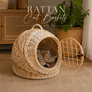 Natural cane cat basket with open woven door and soft resting space for cats in a stylish indoor setting.
