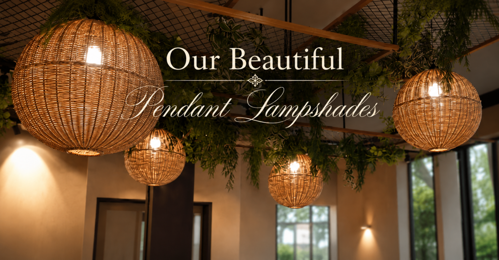Elegant handcrafted woven rattan pendant lampshades suspended among lush greenery, creating a warm ambient glow in a luxurious modern interior setting.