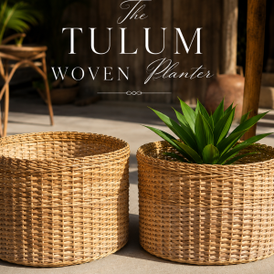 Luxury handwoven wicker planter baskets styled on a tropical verandah with lush greenery, natural cane textures, and warm coastal boho décor. Elegant artisan woven planters with a relaxed resort-inspired aesthetic.