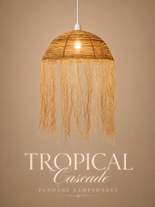 Tropical Cascades handwoven pendant lampshade with flowing raffia fringe, coastal boho lighting, and warm ambient glow in a luxury tropical restaurant setting.