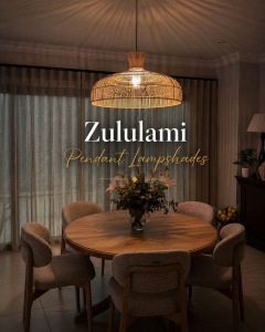 Luxury Zululami pendant lampshades in a tropical beachfront restaurant setting, featuring handwoven natural textures, warm ambient lighting, and elegant coastal dining décor.