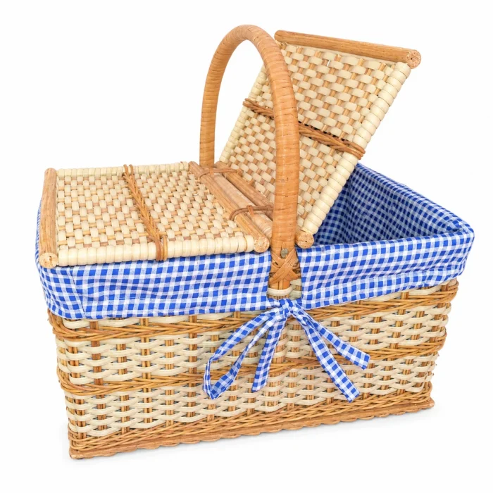 Handcrafted double-lid picnic basket with blue and white gingham inner lining and woven cane finish