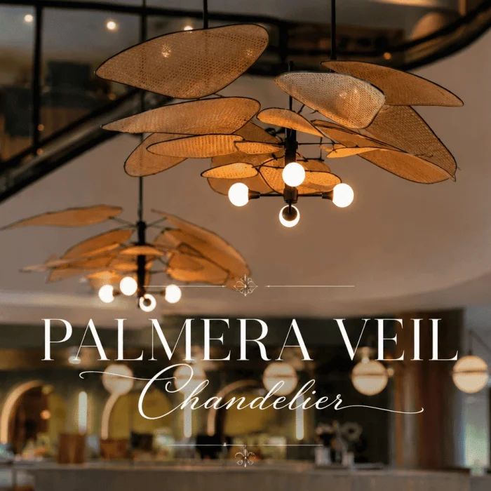 Palmera Veil Chandelier featuring elegant handwoven rattan mesh “leaf” panels arranged in a floating organic design. This luxury statement pendant chandelier casts a warm ambient glow above a sophisticated modern restaurant interior, blending tropical artistry, natural textures, and contemporary coastal elegance.