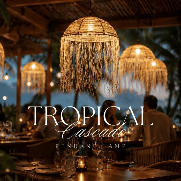 Tropical Cascades handwoven pendant lampshade with flowing raffia fringe, coastal boho lighting, and warm ambient glow in a luxury tropical restaurant setting.