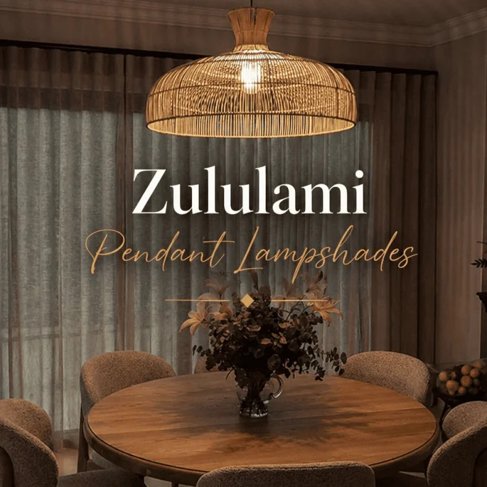 Luxury Zululami pendant lampshades in a tropical beachfront restaurant setting, featuring handwoven natural textures, warm ambient lighting, and elegant coastal dining décor.
