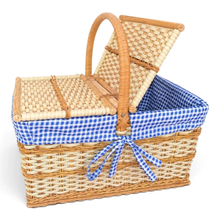 Handcrafted double-lid cane picnic basket with blue gingham lining and open woven lids