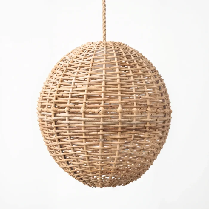 Rustic Radiance oval Palembang cane pendant lampshade on a white studio bac